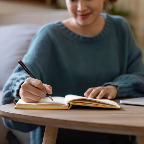 Woman writing down the differences between emergency contraception and the abortion pill