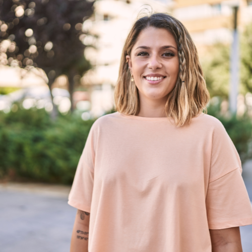 A woman smiling because she knows Your First Look offers free pregnancy services and support in Toledo, Ohio